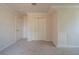 Bedroom showcasing neutral carpet, paint, and closet with built in shelving at 2899 Duncan Pl, Decatur, GA 30034