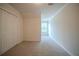 Bedroom featuring neutral carpet, window, and closet at 2899 Duncan Pl, Decatur, GA 30034