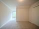 Bedroom featuring neutral carpet, window, and closet at 2899 Duncan Pl, Decatur, GA 30034