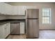 Modern kitchen featuring stainless steel appliances, granite countertops, and ample storage at 2899 Duncan Pl, Decatur, GA 30034