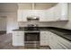 Kitchen featuring granite countertops, stainless steel appliances and tile flooring at 2899 Duncan Pl, Decatur, GA 30034