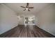 Open-concept living room with hardwood floors leading into the kitchen at 2899 Duncan Pl, Decatur, GA 30034