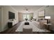 Bright living room featuring neutral furniture, decorative rug, and modern decor at 2899 Duncan Pl, Decatur, GA 30034