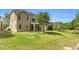 The backyard with a well-maintained lawn offers ample space for outdoor activities and entertainment at 5480 Beaver Ridge Drive Dr, Cumming, GA 30040