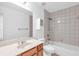 Bright bathroom featuring a shower-tub combination and vanity with large mirror at 5480 Beaver Ridge Drive Dr, Cumming, GA 30040