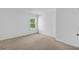 Bedroom featuring a large window and neutral carpeting at 5480 Beaver Ridge Drive Dr, Cumming, GA 30040
