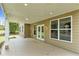 Spacious covered patio with ceiling lights providing a comfortable space for outdoor gatherings at 5480 Beaver Ridge Drive Dr, Cumming, GA 30040
