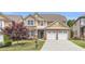 Charming two-story home with brick accents, a well-manicured lawn, and a two-car garage at 5480 Beaver Ridge Drive Dr, Cumming, GA 30040