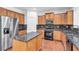 Gourmet kitchen with granite counters, island, stainless appliances, and ample cabinet space at 5480 Beaver Ridge Drive Dr, Cumming, GA 30040
