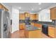 Well-equipped kitchen featuring granite countertops, stainless steel appliances, and a kitchen island at 5480 Beaver Ridge Drive Dr, Cumming, GA 30040