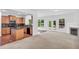 Modern kitchen with stainless steel appliances, granite countertops, and wood cabinetry at 5480 Beaver Ridge Drive Dr, Cumming, GA 30040
