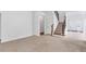 Spacious living room features hardwood floors, a staircase, and an open layout at 5480 Beaver Ridge Drive Dr, Cumming, GA 30040