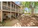 Spacious backyard with a screened-in porch, swing, and stone steps leading to a charming outdoor space at 5628 Fallsbrook Nw Knl, Acworth, GA 30101