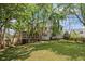 Spacious backyard with ample green space and mature tree coverage at 5628 Fallsbrook Nw Knl, Acworth, GA 30101