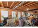 Unfinished basement space with exposed ceiling and stacked household items at 5628 Fallsbrook Nw Knl, Acworth, GA 30101
