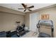 Home gym with treadmill, spin bike, and weights, perfect for staying active and healthy in the comfort of home at 5628 Fallsbrook Nw Knl, Acworth, GA 30101