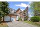 Elegant brick home boasts attached garage and lush lawn, blending comfort with curb appeal at 5628 Fallsbrook Nw Knl, Acworth, GA 30101