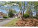 Lovely brick home with an attached two-car garage, mature trees, and manicured landscaping at 5628 Fallsbrook Nw Knl, Acworth, GA 30101