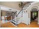 Grand two-story foyer with staircase, hardwood floors, and views into the dining room at 5628 Fallsbrook Nw Knl, Acworth, GA 30101