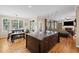 Bright, open kitchen featuring a large island, hardwood floors, and seamless flow into the living room at 5628 Fallsbrook Nw Knl, Acworth, GA 30101