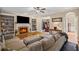 Spacious living room featuring built-in bookshelves, a cozy fireplace, and comfortable seating at 5628 Fallsbrook Nw Knl, Acworth, GA 30101