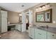 Light and bright main bathroom featuring double sinks, neutral tones, and vanity area at 5628 Fallsbrook Nw Knl, Acworth, GA 30101