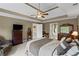 Comfortable main bedroom with a trey ceiling, fan, and ensuite bathroom at 5628 Fallsbrook Nw Knl, Acworth, GA 30101