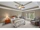 Main bedroom with a trey ceiling, fan, neutral tones, and great natural light at 5628 Fallsbrook Nw Knl, Acworth, GA 30101