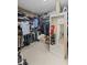 Spacious walk-in closet with extensive shelving, rods, and full-length mirror for ample storage and convenience at 5628 Fallsbrook Nw Knl, Acworth, GA 30101