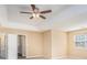 Bedroom featuring ceiling fan, windows, and door at 1027 Fellowship Rd, Fairburn, GA 30213