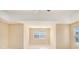 This bedroom features neutral walls, carpet, and a bright window at 1027 Fellowship Rd, Fairburn, GA 30213