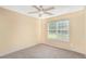 Bedroom featuring carpet flooring, ceiling fan, and window at 1027 Fellowship Rd, Fairburn, GA 30213