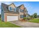 Side view of brick house featuring a spacious driveway and manicured lawn at 1027 Fellowship Rd, Fairburn, GA 30213