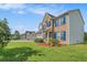 Two-story home featuring manicured lawn and well-maintained landscaping at 1027 Fellowship Rd, Fairburn, GA 30213