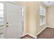 Light and bright foyer with decorative glass front door and hardwood floors at 1027 Fellowship Rd, Fairburn, GA 30213