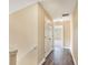 Hallway featuring hardwood floors, white trim and baseboards, and neutral walls at 1027 Fellowship Rd, Fairburn, GA 30213