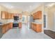 Spacious kitchen featuring stainless steel appliances and abundant cabinet space at 1027 Fellowship Rd, Fairburn, GA 30213