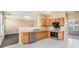 Modern kitchen with stainless steel appliances, breakfast bar, and ample counter space at 1027 Fellowship Rd, Fairburn, GA 30213