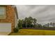 Backyard featuring a privacy fence, a lawn, and some trees at 1800 Pearson St, Loganville, GA 30052