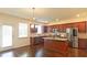 Well-equipped kitchen boasts stainless steel appliances, granite countertops, and a center island at 1800 Pearson St, Loganville, GA 30052