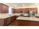 Spacious kitchen features stainless steel appliances, granite countertops, and ample cabinet space at 1800 Pearson St, Loganville, GA 30052