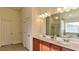 Spacious main bathroom with double vanity, separate tub, and shower at 1800 Pearson St, Loganville, GA 30052