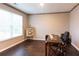 Bright office space with hardwood floors, a large window, and a desk at 1800 Pearson St, Loganville, GA 30052