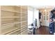 Walk-in closet provides ample storage with built-in shelving and hanging rods at 1800 Pearson St, Loganville, GA 30052