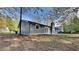 Exterior view of a home showing the backyard, back of the home, and patio at 4111 Sweet Water Ct, Conyers, GA 30094