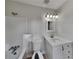 Clean bathroom featuring shower/tub combo, new vanity, and modern fixtures at 4111 Sweet Water Ct, Conyers, GA 30094