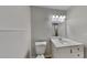 Bathroom featuring modern fixtures, vanity, a toilet, and a decorative light fixture at 4111 Sweet Water Ct, Conyers, GA 30094