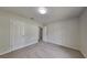 Cozy bedroom featuring neutral walls, soft carpet, and a ceiling light at 4111 Sweet Water Ct, Conyers, GA 30094