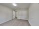 Comfortable bedroom with neutral walls, soft carpet, closet, and a ceiling light at 4111 Sweet Water Ct, Conyers, GA 30094