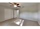 Bedroom featuring carpet, ceiling fan, and closet at 4111 Sweet Water Ct, Conyers, GA 30094